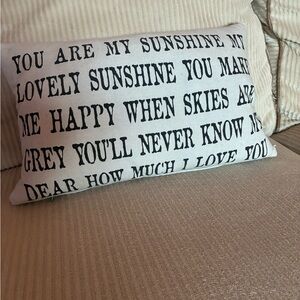 Decorative White Pillow with Black Text